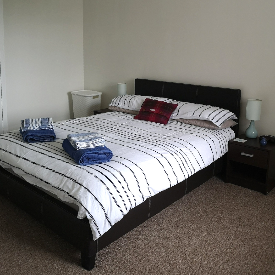Double bedroom at No. 1 Ardveenish with fresh linen and Harris Tweed cushion