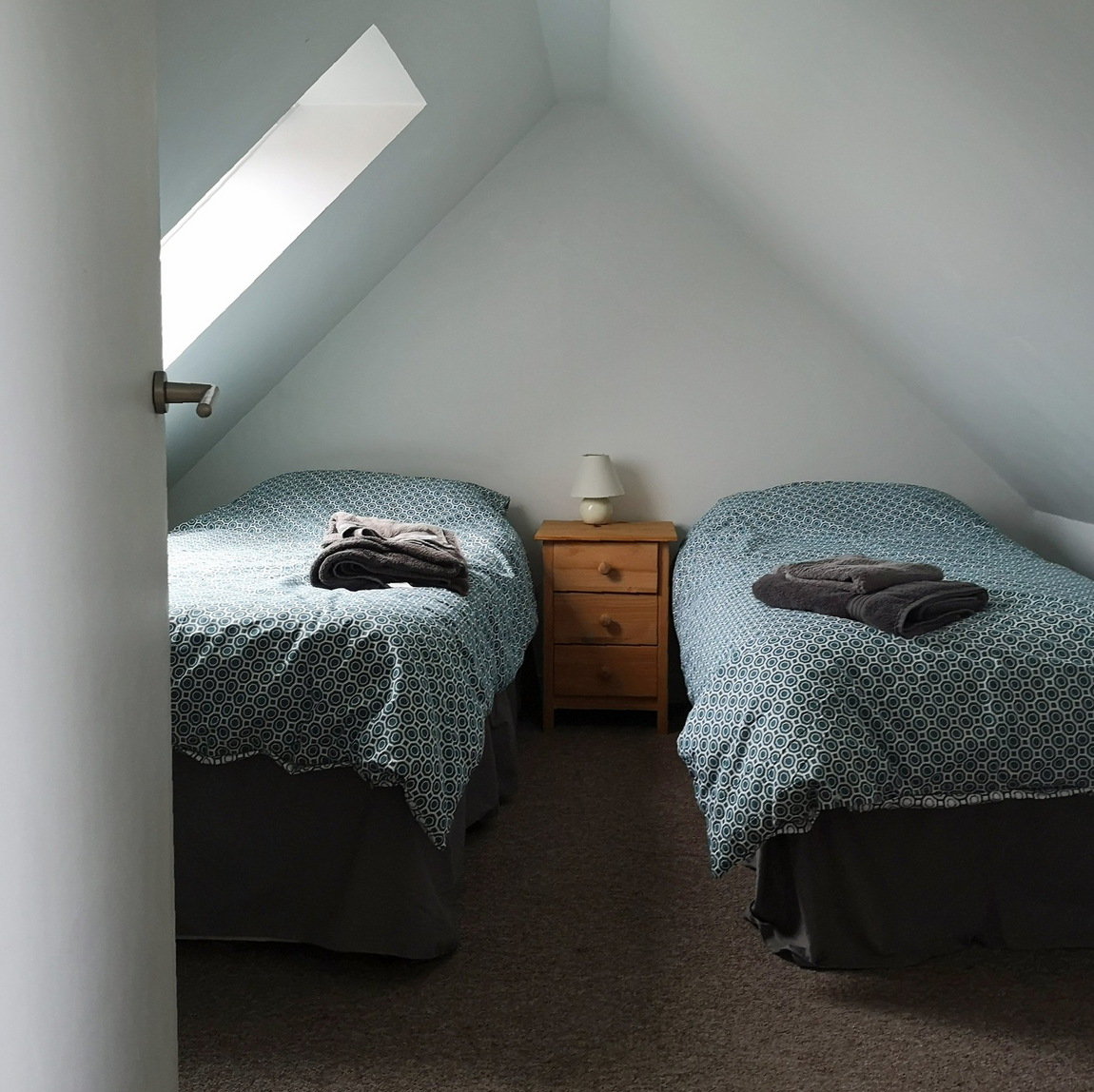 Twin bedroom at No. 1 Ardveenish under the eaves with Velux skylight